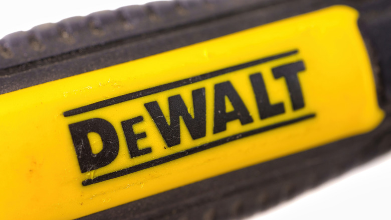 The DeWalt logo on a screwdriver handle.