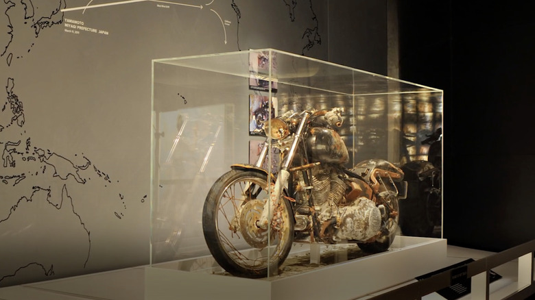 Harley-Davidson Tsunami motorcycle in transparent display box at museum