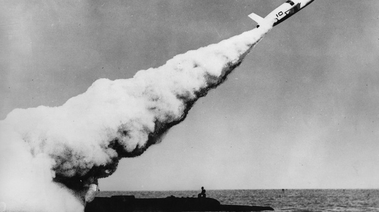 black and white photo of submarine launching missile