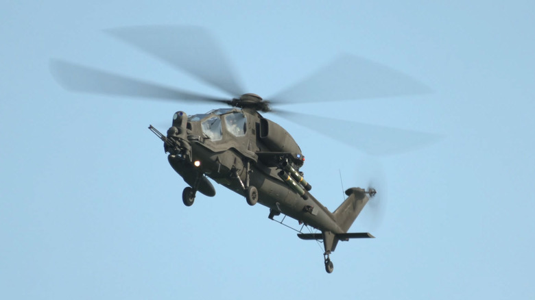 Agusta A129 Mangusta attack helicopter flying in clear blue skies