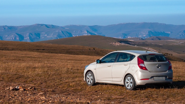 Hyundai Accent in an open field