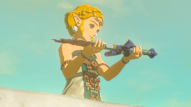 Zelda holding a broken Master Sword