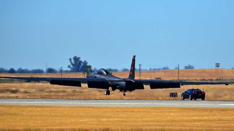 U-2 chase car with U-2 landing on runway