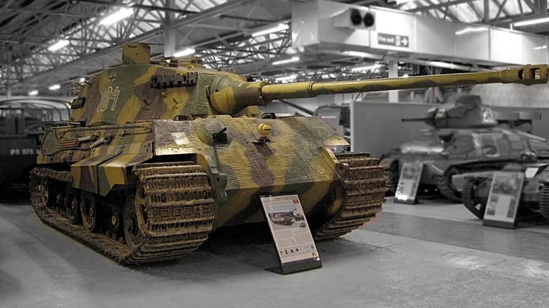 Tiger II tank with camo paint in a museum