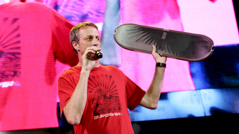 Tony Hawk showing skateboard