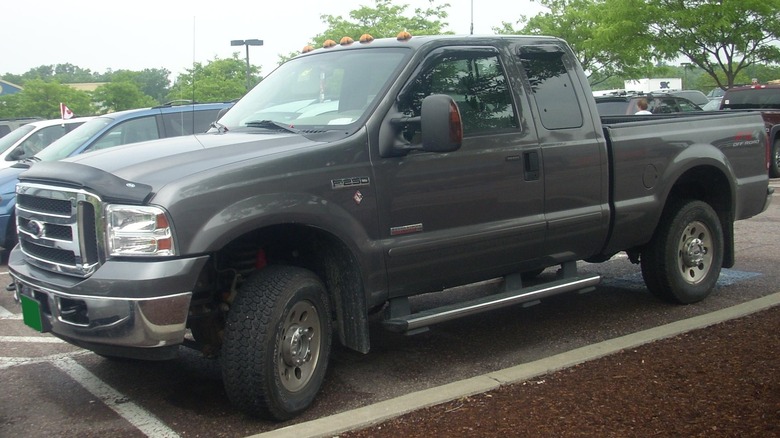 Silver Ford F-250 Super Duty diesel pickup in a parking lot