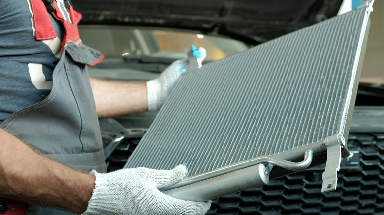 Mechanic inspects a new radiator