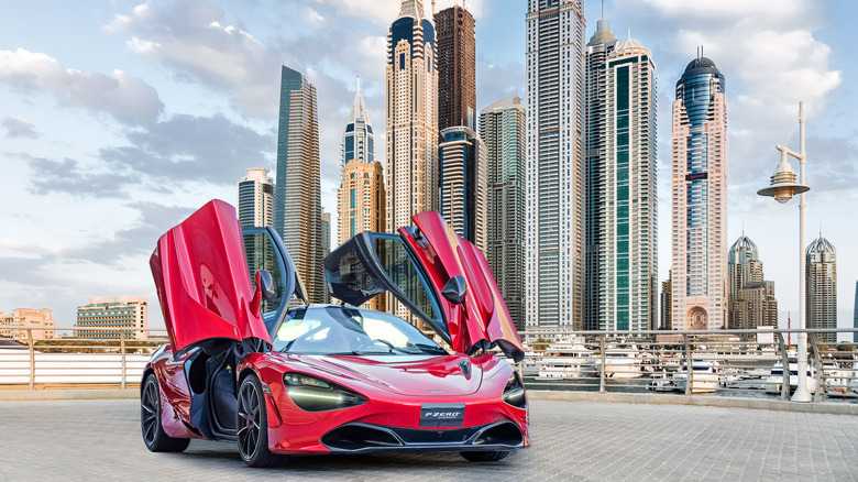 red McLaren 720S doors open city