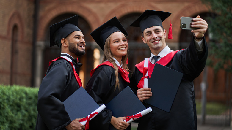 Graduate students take a selfie with an iPhone