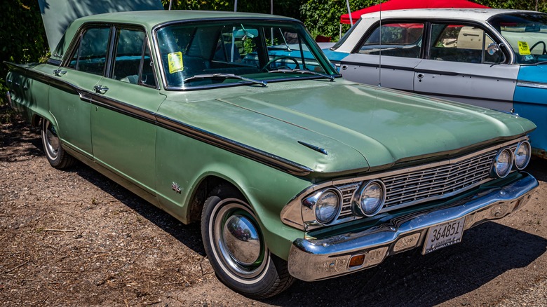 1960s Fairlane parked on gravel