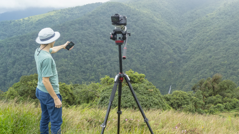 man using tripod