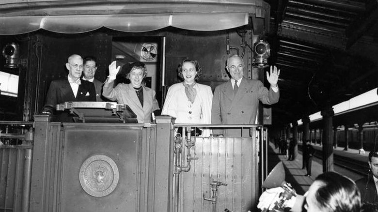 President Truman, his wife, and daughter waving from train, 1948