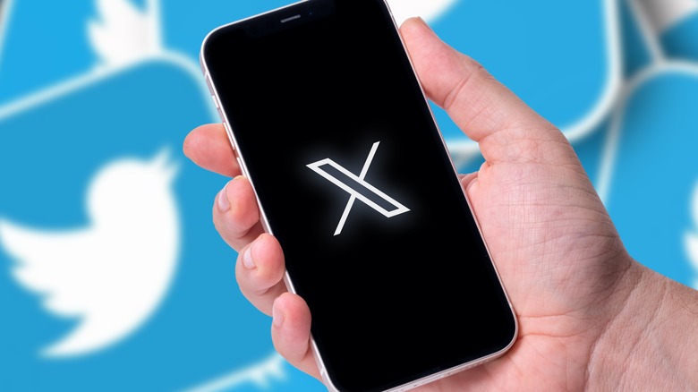 X logo on phone, Twitter old logo in background