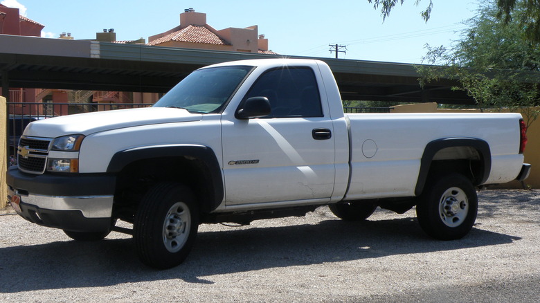 White 2005 Chevrolet Silverado HD parked on gravel