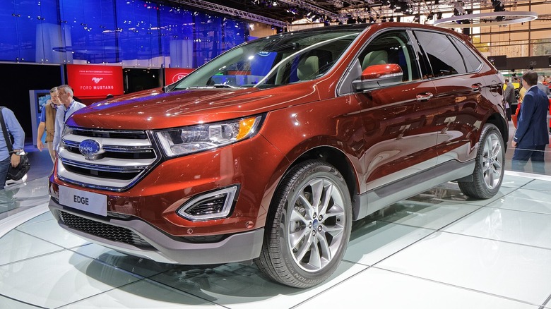 Red 2014 Ford Edge on display in a showroom