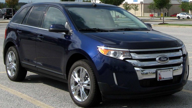 Blue 2011 Ford Edge parked in a parking lot