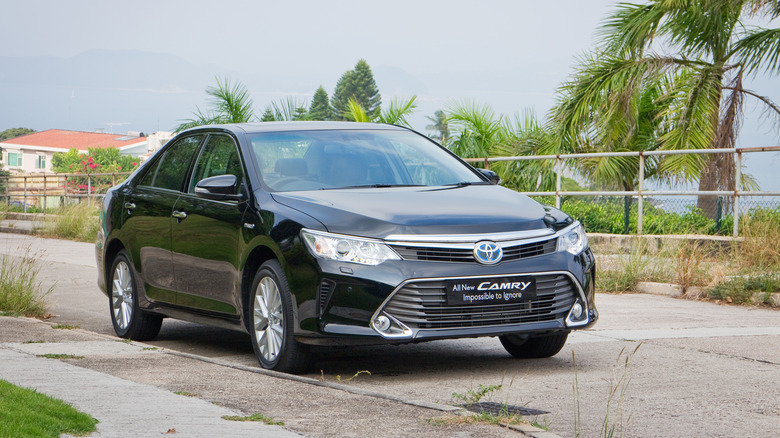 Black Toyota Camry Hybrid parked