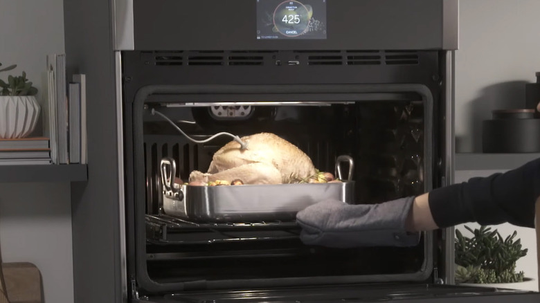 A GE oven with a built-in thermometer