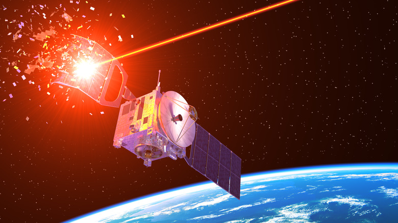 Laser beam shooting down a satellite in space