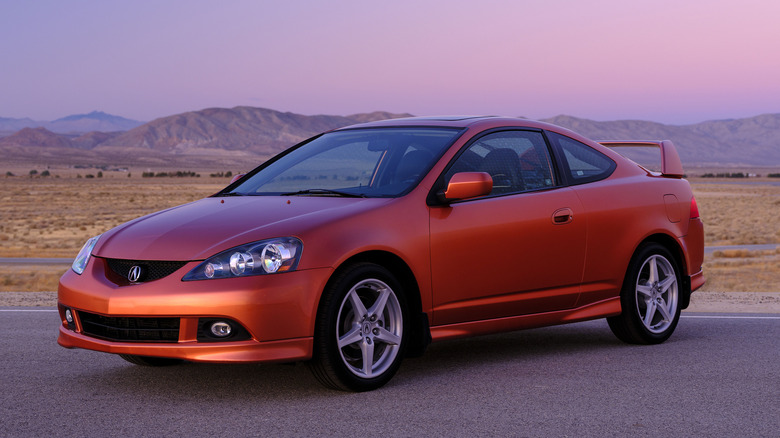 A red 2006 Acura RSX Type S in the desert.