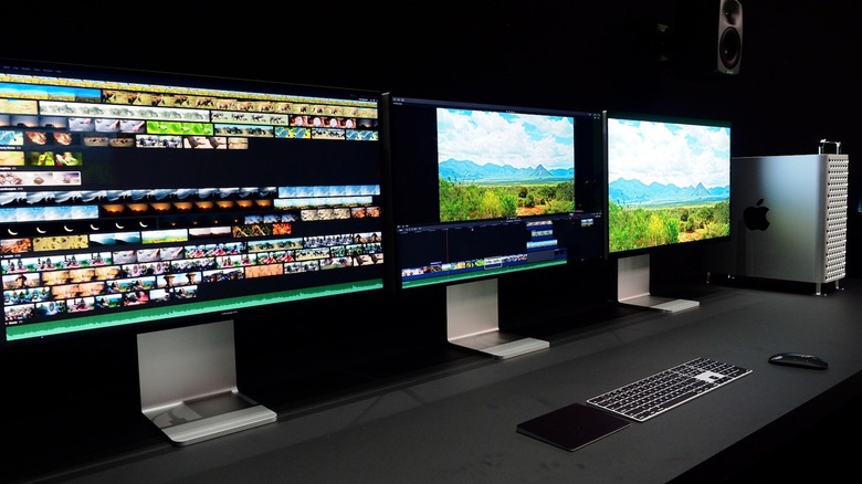 Row of Apple displays and Mac Pro