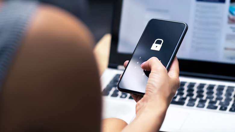 Woman unlocking phone with PIN