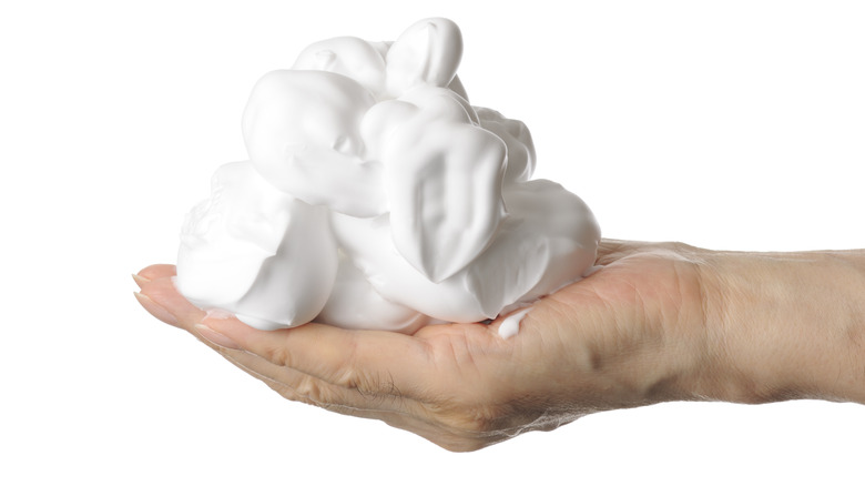 shaving cream in hand