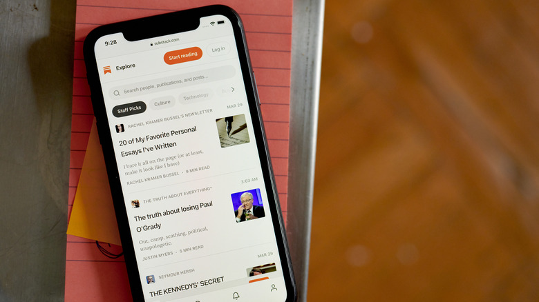 smartphone displaying a Substack subscription feed on screen