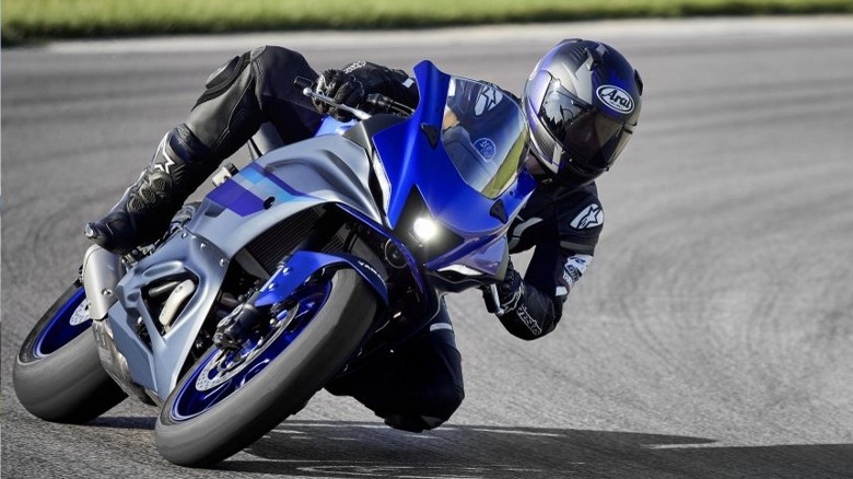 person riding Yamaha on track