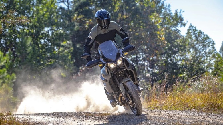 Person riding Yamaha on dirt trail