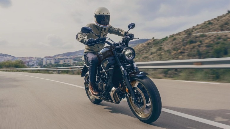 person riding Yamaha on road