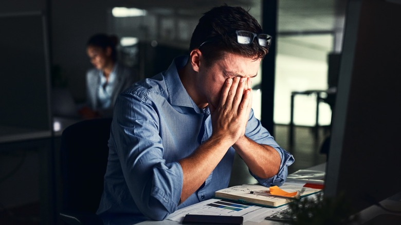 stressed man at computer