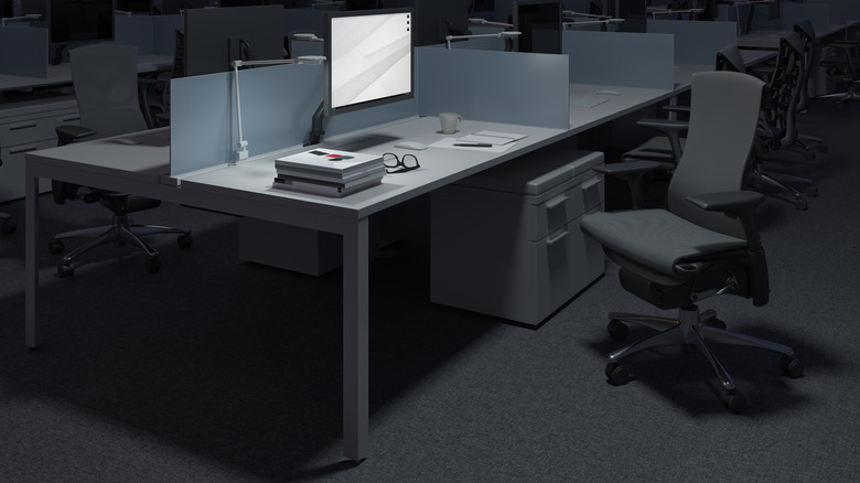 computer cubicle with empty chair