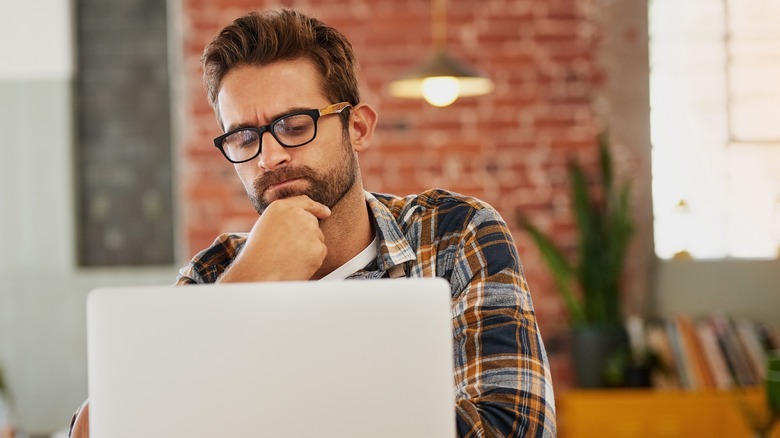 Thinking man at computer