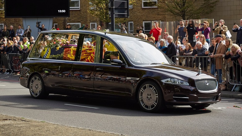 Queen Elizabeth II's coffin in a Jaguar hearse