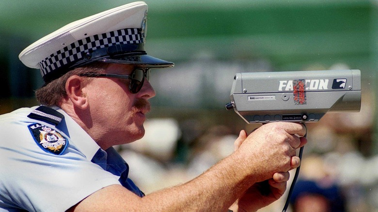 policeman using radar gun