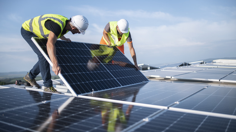 engineers installing solar panels