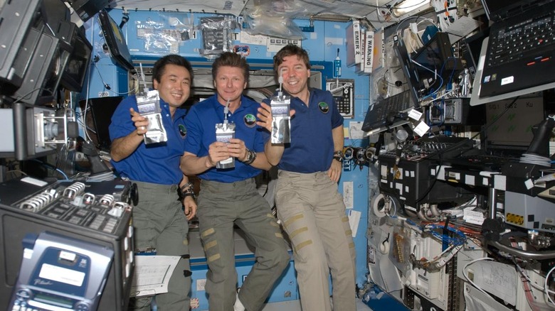 NASA Expedition 19 astronaut crew aboard the ISS drinking water