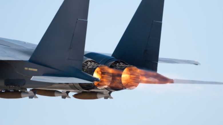 F-15 engine nozzles with flames erupting.