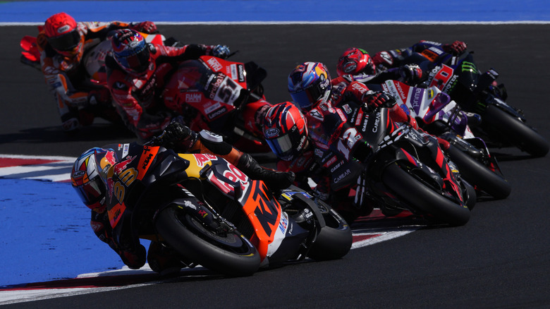 MotoGP racers ripping down a track