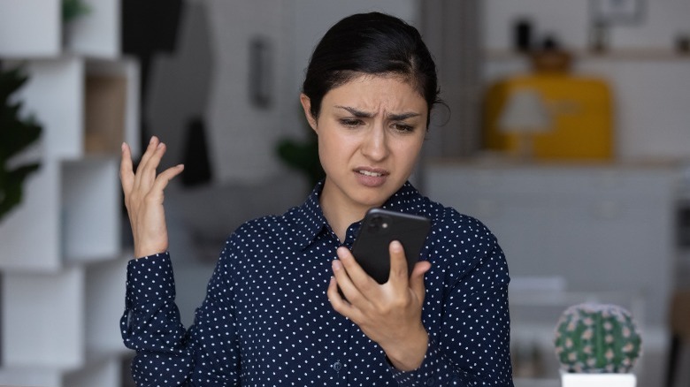 woman frustrated with phone