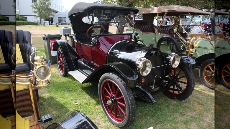 Front quarter view of red 1915 Chevy H-2 Royal Mail parked