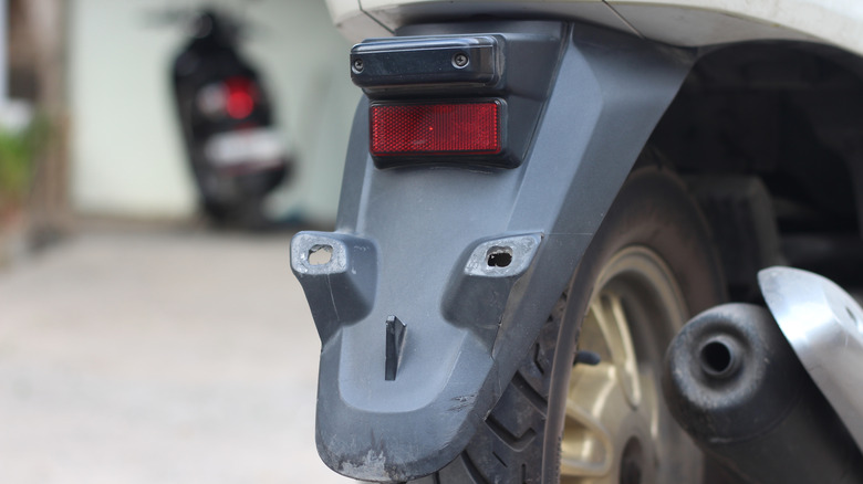 The back of a motorcycle with no visible plate