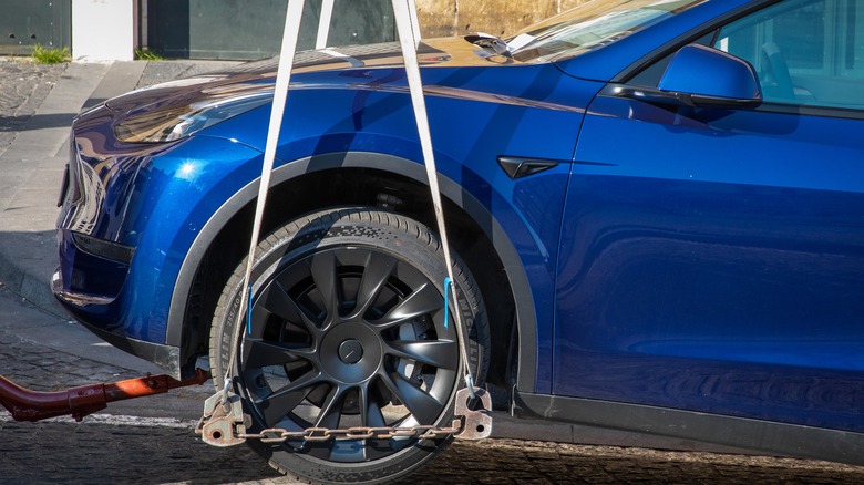 Tesla vehicle attached to a tow truck