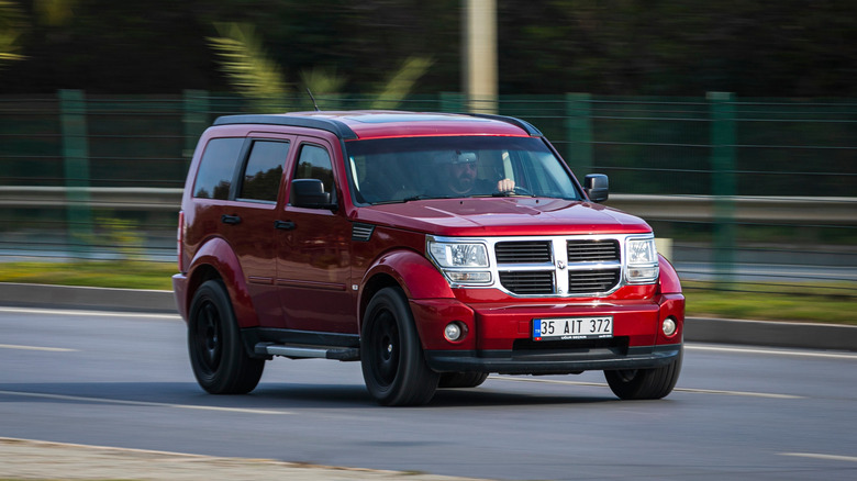 Red Dodge Nitro on the highway