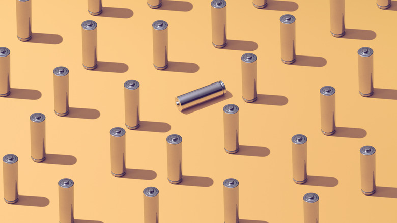 repetitive concept graphic of batteries, orange background