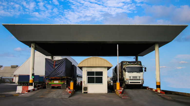 Two trucks at weigh station