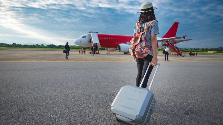 woman boarding plane