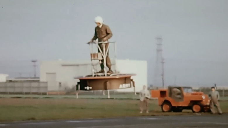 Man riding on a circular hovercraft