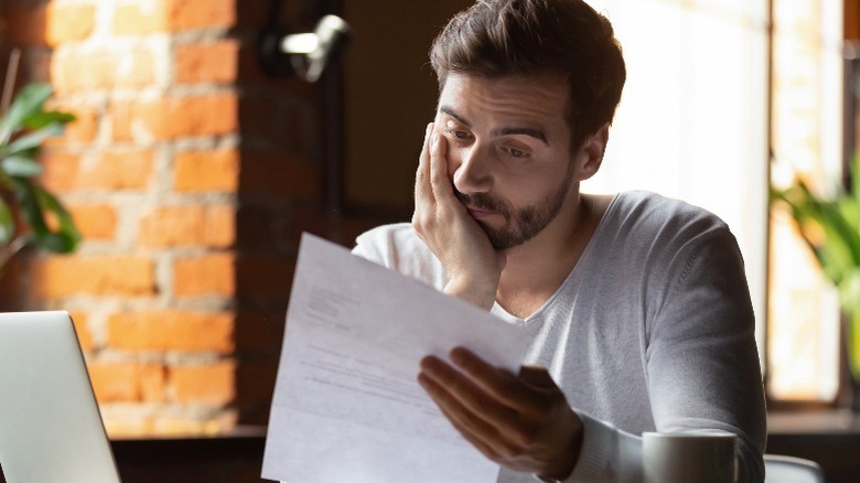 person reading piece of paper